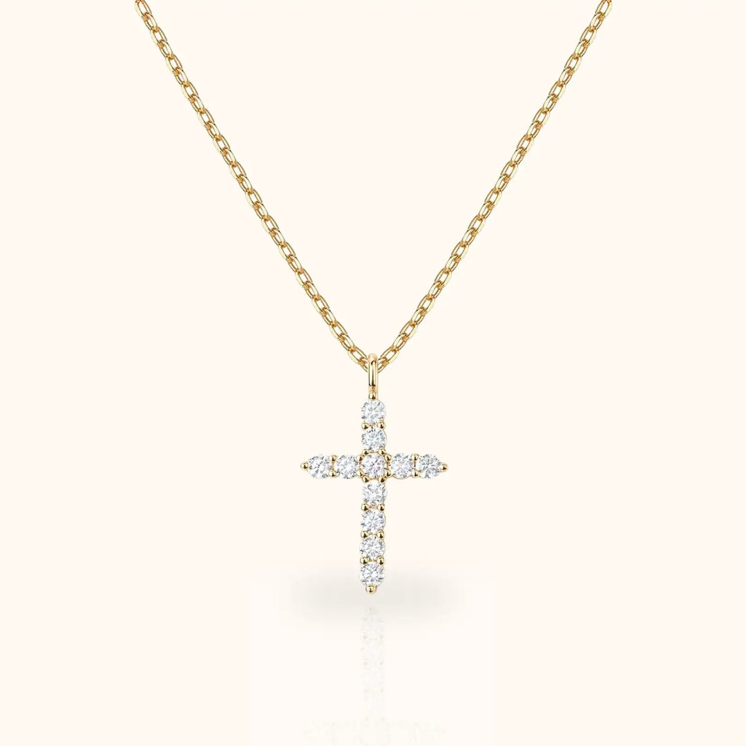 Gold cubic zirconia cross pendant necklace. A delicate and elegant rose gold cross necklace with sparkling CZ stones for a timeless look.