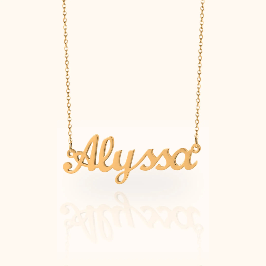 Gold necklace with 'Alyssa' pendant on a white background
